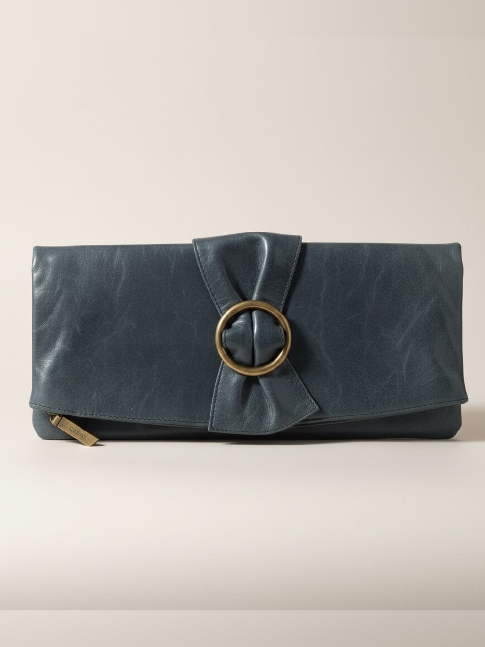 Hobo International leather fold over clutch with a distinctive brass ring detail